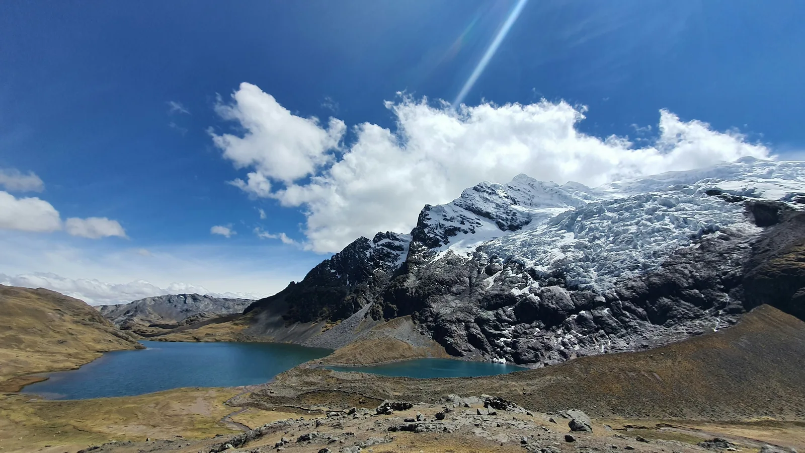 Apu Ausangate rising above a glacial lagoon